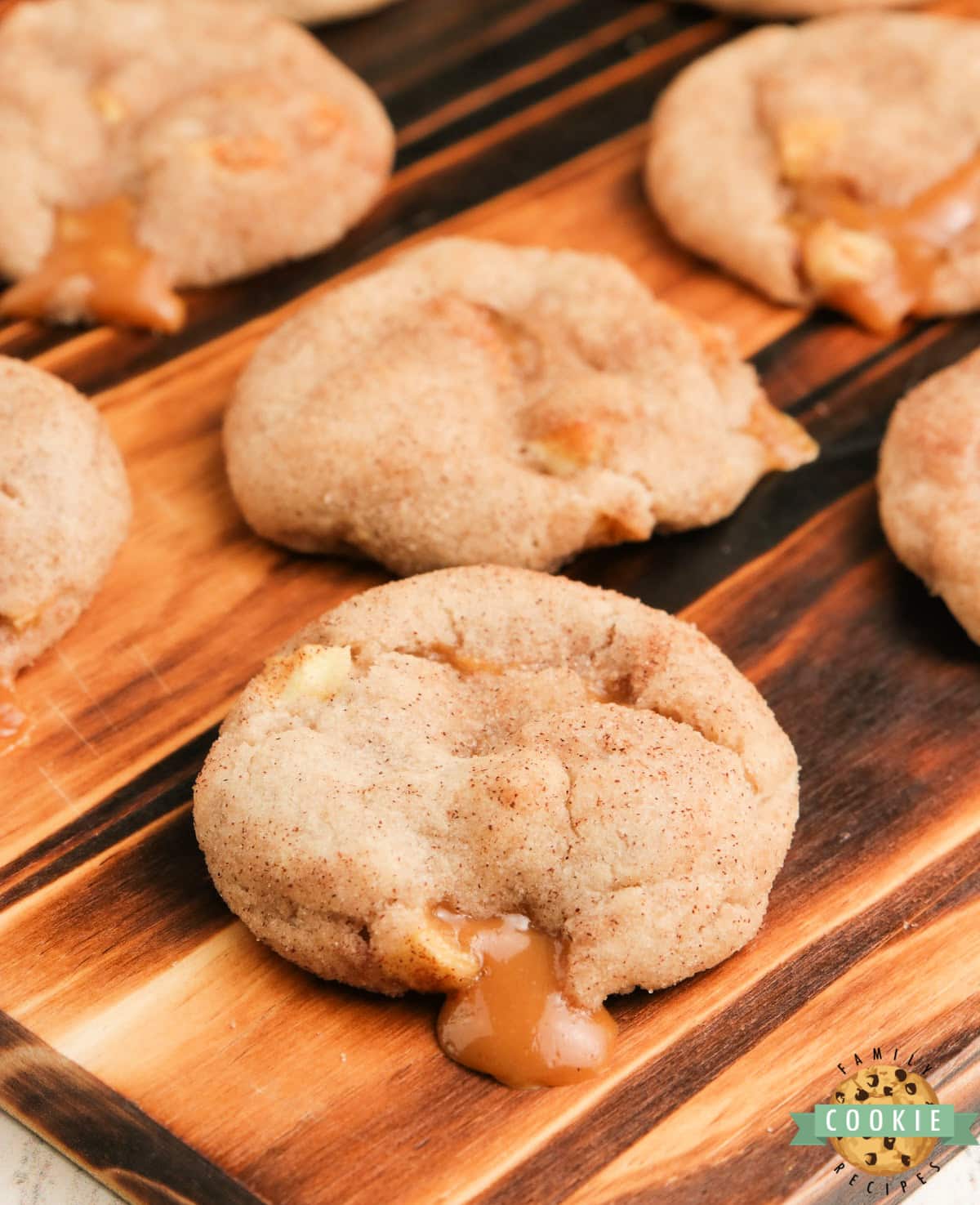 Caramel Apple Snickerdoodles add fresh apples and a gooey caramel filling to your favorite snickerdoodle cookie recipe. Soft and chewy cinnamon sugar cookies that are perfect for fall!