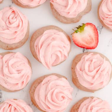 strawberry cookies topped with strawberry buttercream rosettes