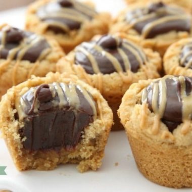 Fudge Peanut Butter Cookie Cups are peanut butter cookies baked in a mini muffin pan and filled with a simple chocolate fudge! Delicious flavor combination in these amazing treats.