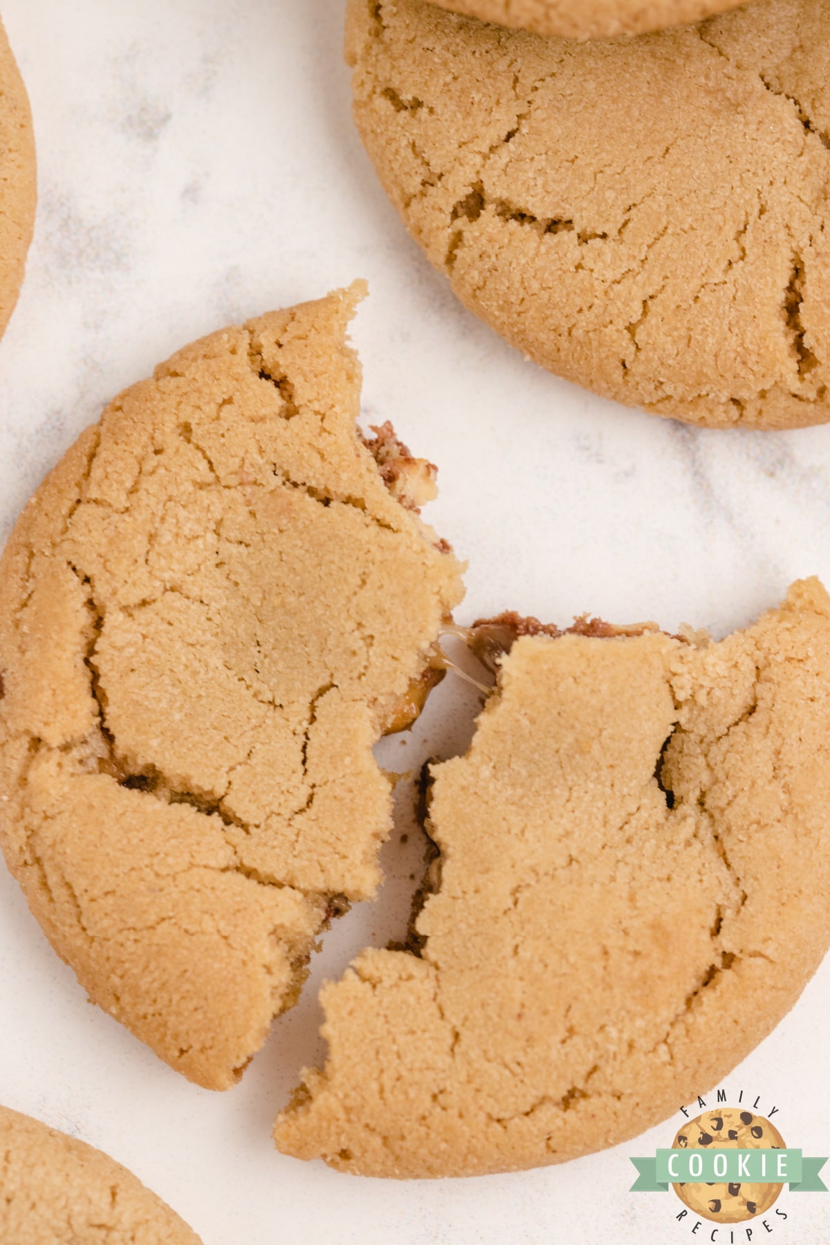 Peanut butter cookies with a miniature Snickers in the middle