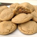 Snickers Peanut Butter Cookies take an already incredible soft and delicious peanut butter cookie recipe, and add a Snickers surprise in the middle!