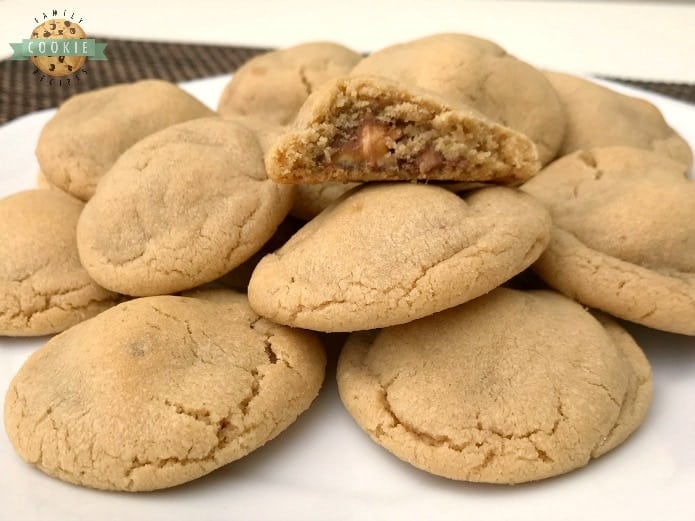 Snickers Peanut Butter Cookies take an already incredible soft and delicious peanut butter cookie recipe, and add a Snickers surprise in the middle!