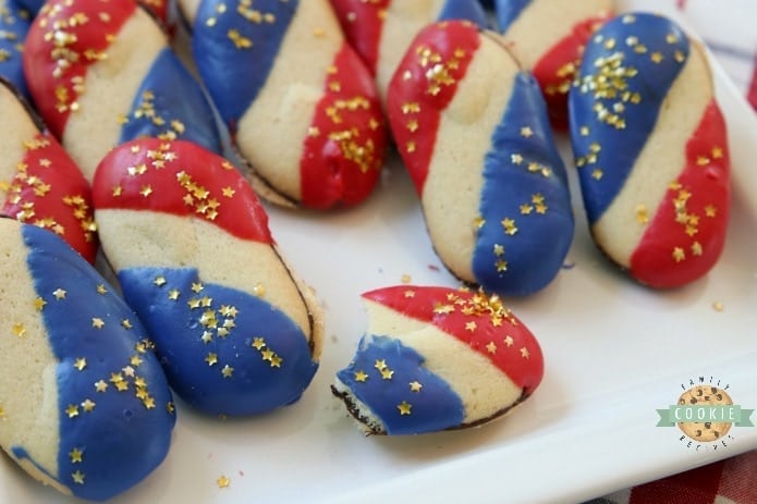 Super Simple 4th of July Cookies made with just 4 ingredients and NO BAKE! Easy red, white and blue cookies made with Milano cookies dipped in red and blue melting chocolate then sprinkled with gold stars. Made in just 15 minutes and they're perfectly patriotic!