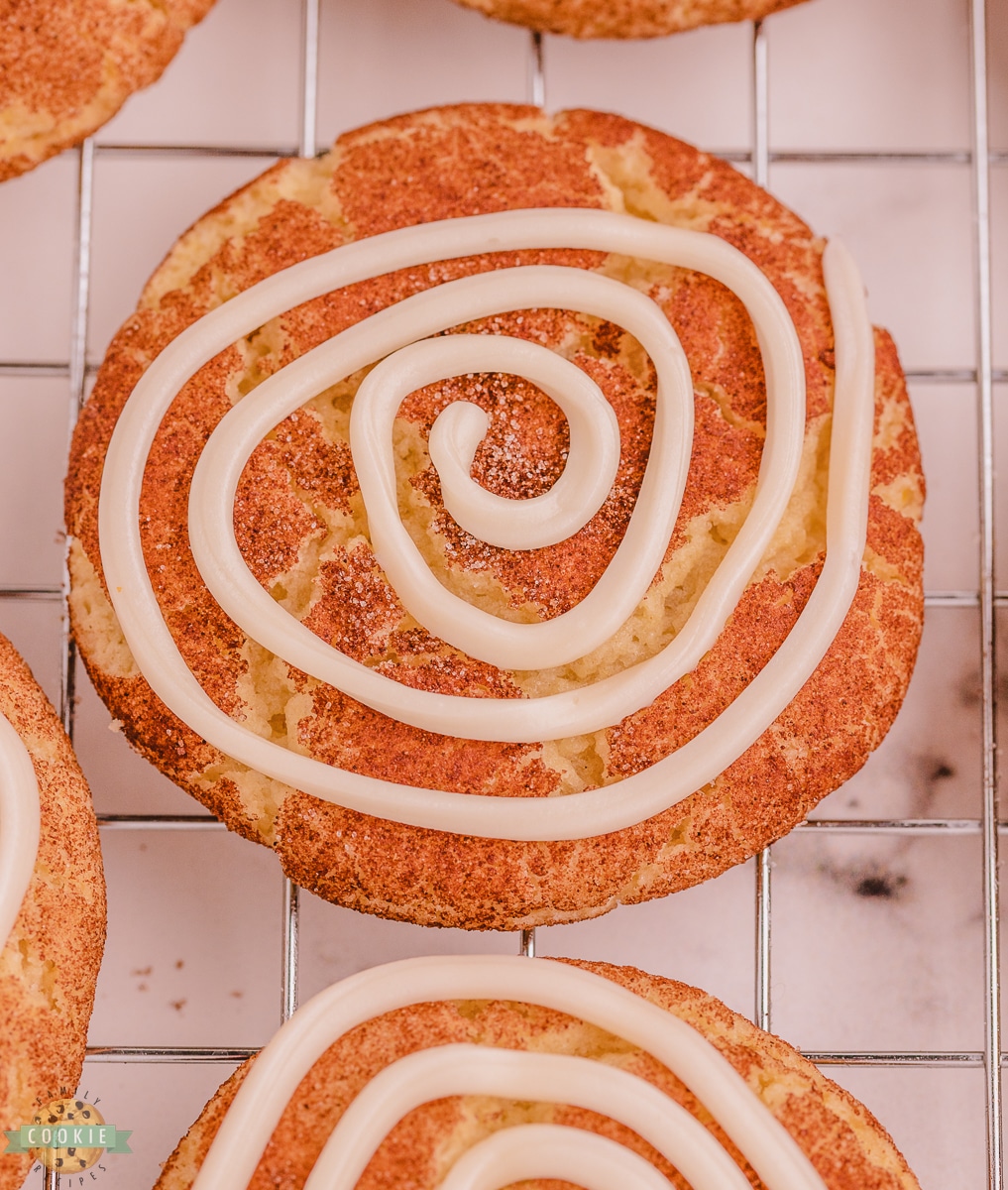 vanilla swirled icing on a snickerdoodle