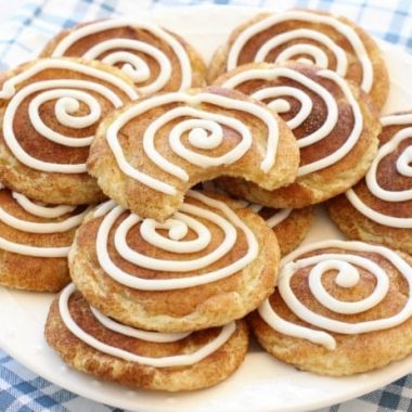 Cinnamon Roll Snickerdoodles are your favorite snickerdoodle cookies with the addition of a sweet vanilla swirl on top! A fun variation on a Snickerdoodle recipe for anyone who loves Cinnamon Rolls!