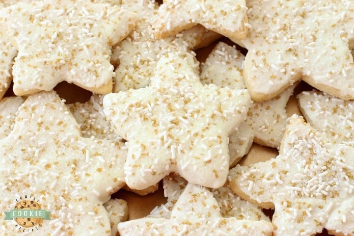 Holiday Star Cookies are bright, buttery & sparkly. They're perfect for the holidays! Candy coated & sprinkled to holiday perfection, everyone loves these melt-in-your mouth vanilla shortbread cookies.