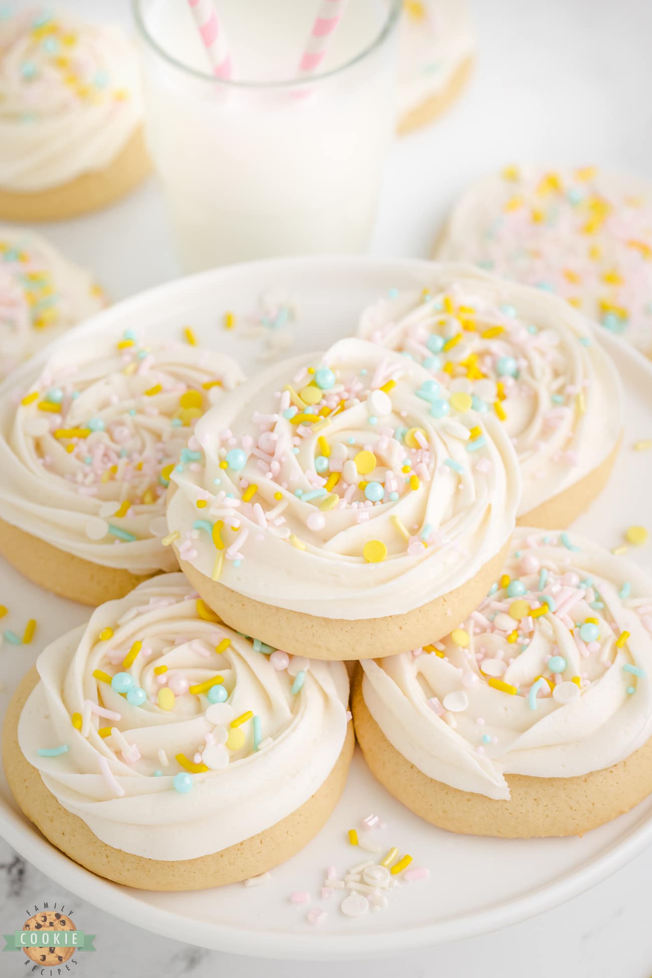 frosted sugar cookies on a plate