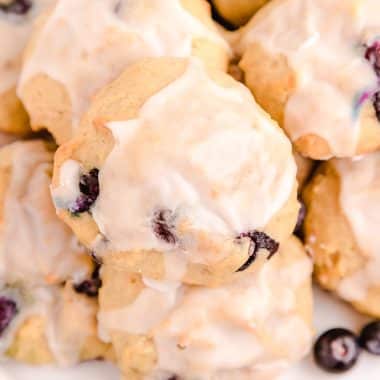 iced blueberry banana cookies on a plate