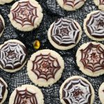 Halloween Cobweb Cookies are spectacularly spooky and completely delicious! Sugar cookies topped with chocolate & vanilla icing- no coloring! Quick & easy spider web design made in seconds. Perfect Halloween treats!