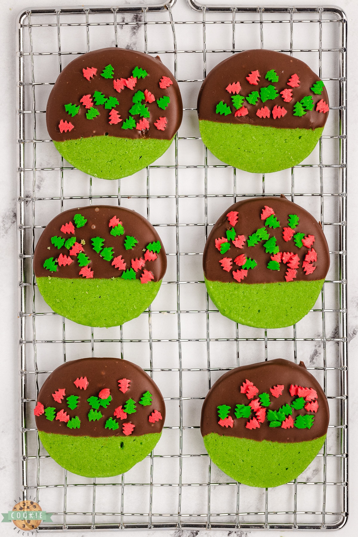 green Christmas cookies on a cooling rack