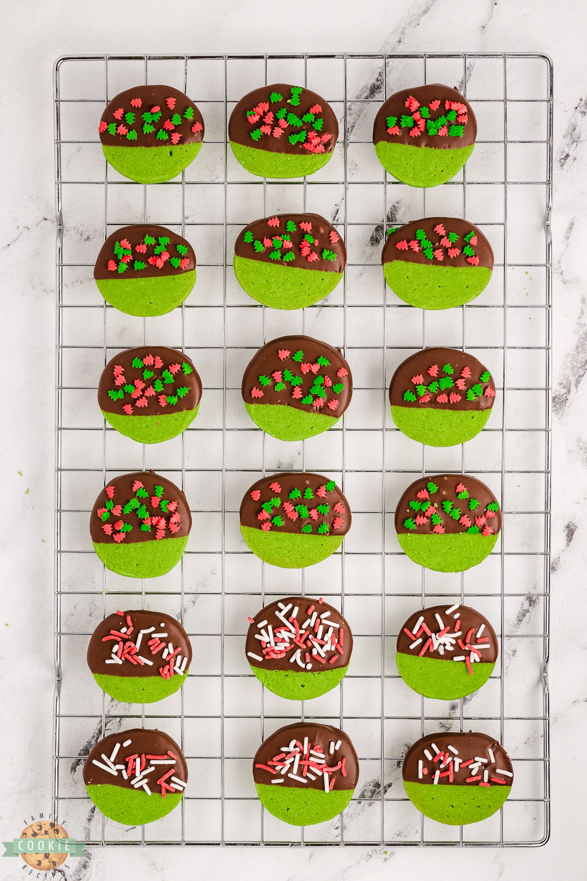 mint green Christmas cookies on a cooling rack