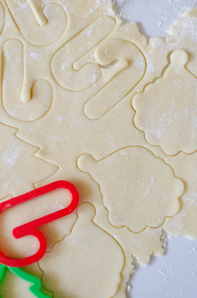 Christmas Sugar Cookies are a necessary holiday tradition at our house! This simple sugar cookie recipe produces soft, chewy and delicious cut-out cookies that can be decorated with a simple 4-ingredient buttercream frosting.
