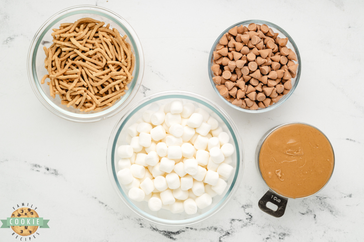 Ingredients for marshmallow peanut butter no bake cookies including butterscotch chips, peanut butter, chow mein noodles, and mini marshmallows.
