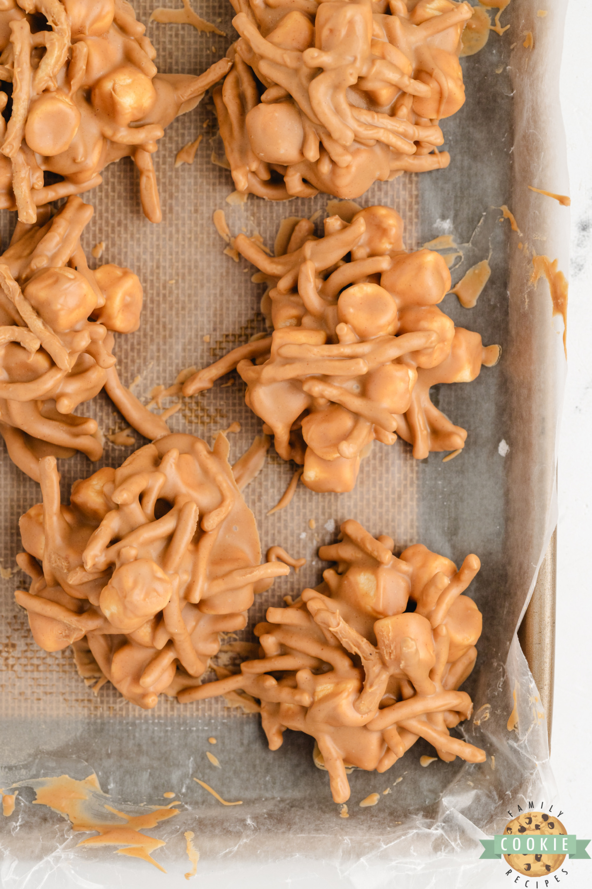 Marshmallow peanut butter no bake cookies on a cookie sheet.