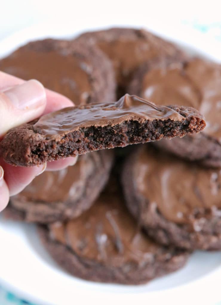 Easy Brownie Cookies are easily made with a brownie mix, butter and an egg and then frosted with a little bit of a melted Hershey bar. One of the easiest cookie recipes ever and they taste just like brownies...in cookie form!