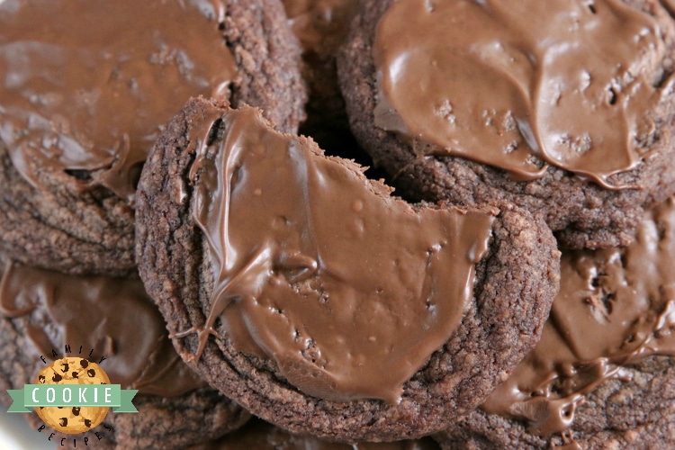 Easy Brownie Cookies are easily made with a brownie mix, butter and an egg and then frosted with a little bit of a melted Hershey bar. One of the easiest cookie recipes ever and they taste just like brownies...in cookie form!