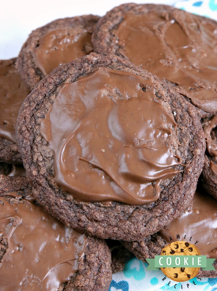 Easy Brownie Cookies are easily made with a brownie mix, butter and an egg and then frosted with a little bit of a melted Hershey bar. One of the easiest cookie recipes ever and they taste just like brownies...in cookie form!