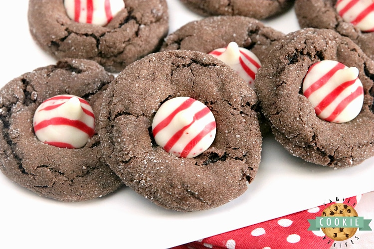 Chocolate Peppermint Blossoms are made with a cake mix, eggs, butter, and Hershey's Candy Cane Kisses. This easy cake mix cookie recipe yields soft and chewy chocolate cookies with just the right amount of peppermint!