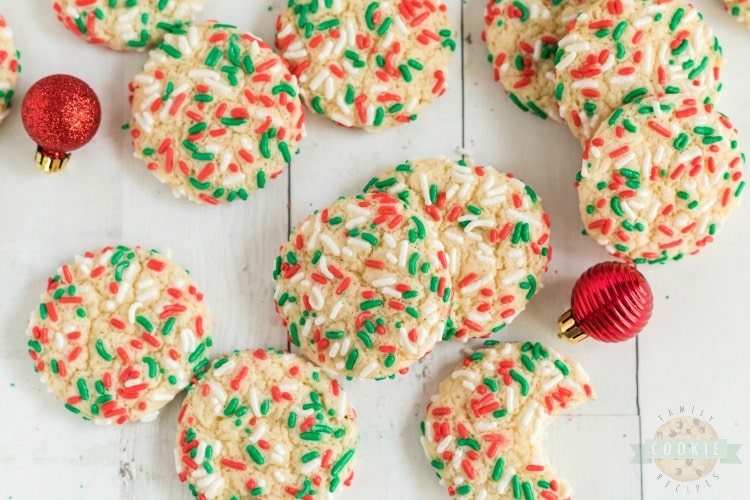 Christmas Sprinkle Cookies are sugar Cookies rolled in Christmas sprinkles for a special holiday treat! Delightfully soft & chewy Christmas cookies made with festive holiday sprinkles!