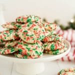 Christmas Sprinkle Cookies are sugar Cookies rolled in Christmas sprinkles for a special holiday treat! Delightfully soft & chewy Christmas cookies made with festive holiday sprinkles!
