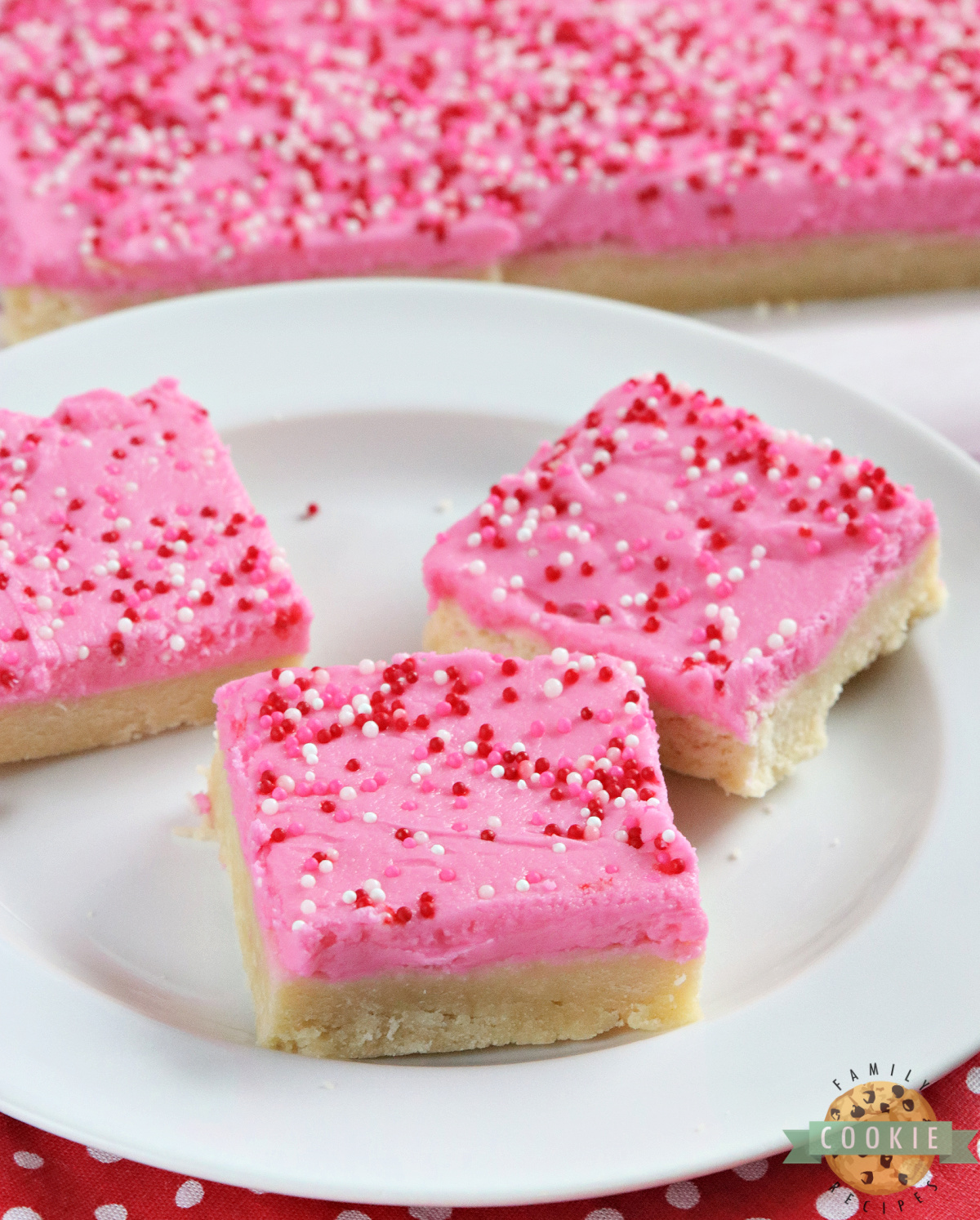 Sugar cookie bars topped with vanilla buttercream frosting.