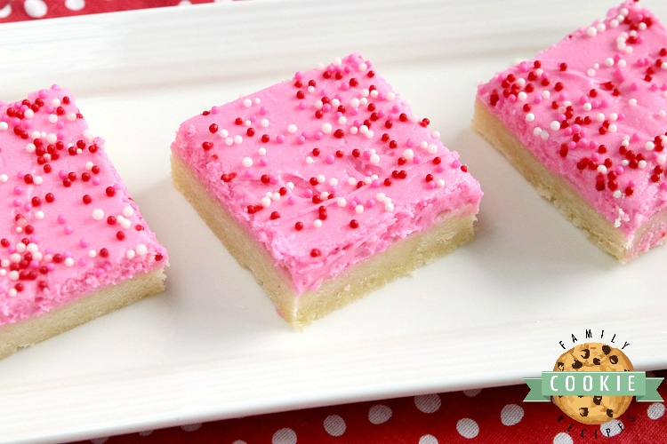 Sugar Cookie Bars are thick, soft and frosted with a delicious vanilla buttercream frosting. Simple sugar cookie recipe that is made in a pan and can be easily sliced and served.