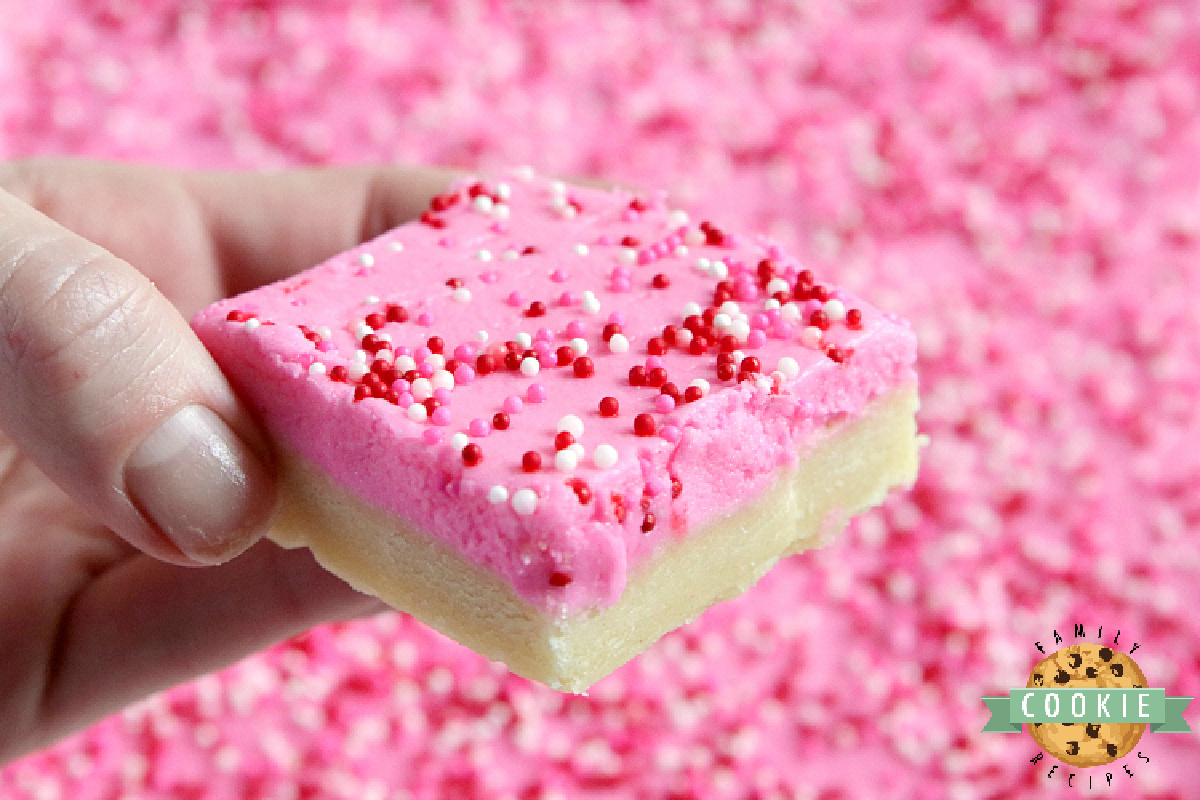 Thick sugar cookie bars sliced into squares.