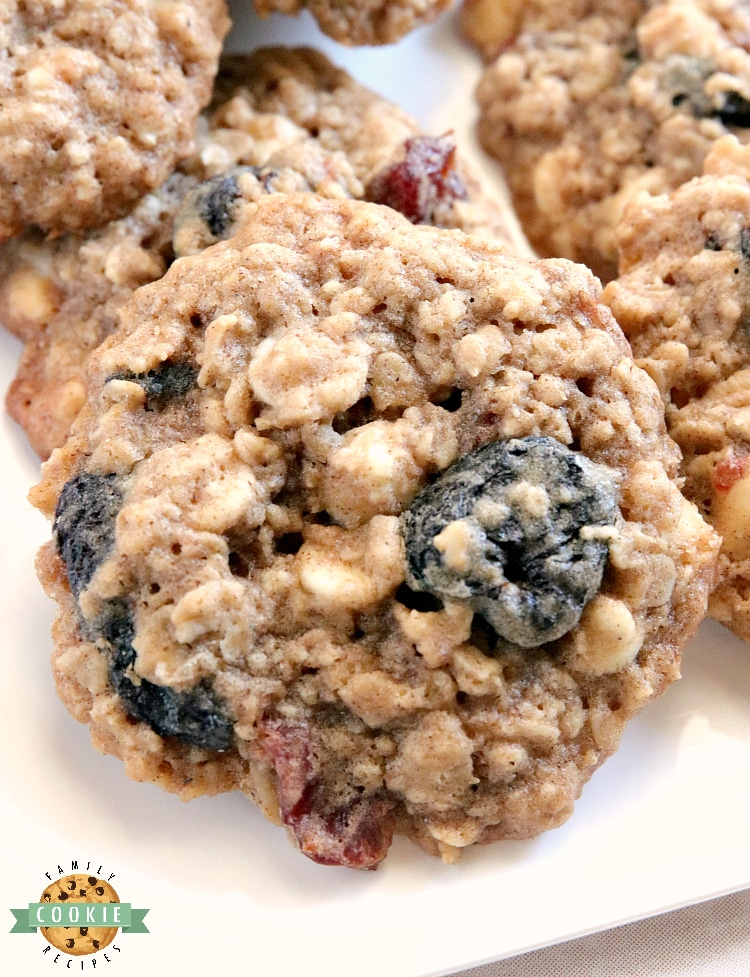 White Chocolate Cherry Oatmeal Cookies are made by adding white chocolate chips and dried cherries to the most amazing oatmeal cookie recipe ever! These cookies are soft and chewy and the flavors are incredible.