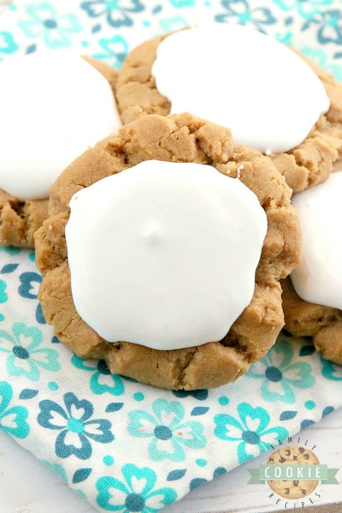 Fluffernutter Cookies take a traditional peanut butter cookie recipe to the next level by adding marshmallow fluff to the top! The peanut butter and marshmallow combination is absolutely amazing in this cookie recipe!