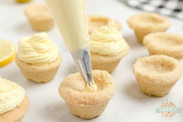 Lemon cream pie cookies are a delicious way to enjoy the tastes of a lemon cream pie without the hassle of pie crust. These lemon cookie cups are easy to grab and go and this lemon cookie recipe makes enough to share.