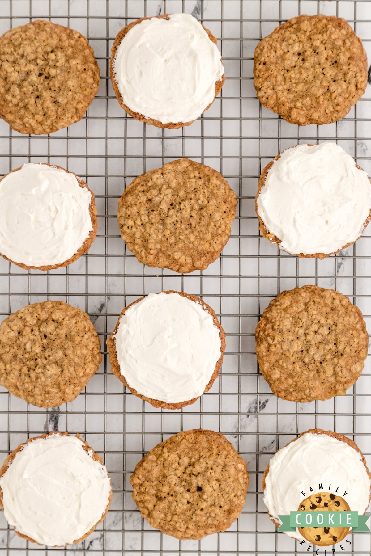 Placing the filling between 2 oatmeal cookies 