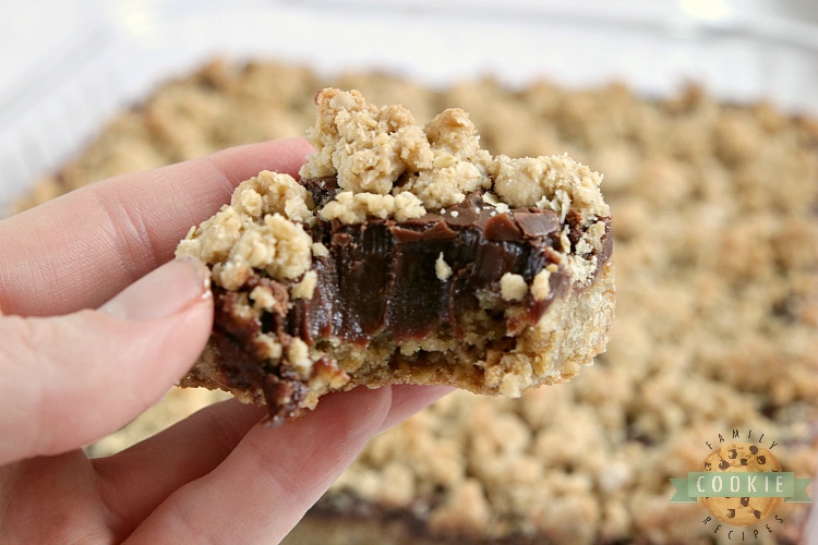 Fudgy Oatmeal Cookie Bars are made with a thick chocolate ganache in between two layers of a soft and chewy oatmeal cookie recipe.  This cookie bar recipe is absolutely amazing!