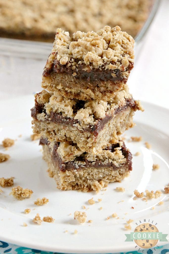 Fudgy Oatmeal Cookie Bars are made with a thick chocolate ganache in between two layers of a soft and chewy oatmeal cookie recipe.  This cookie bar recipe is absolutely amazing!