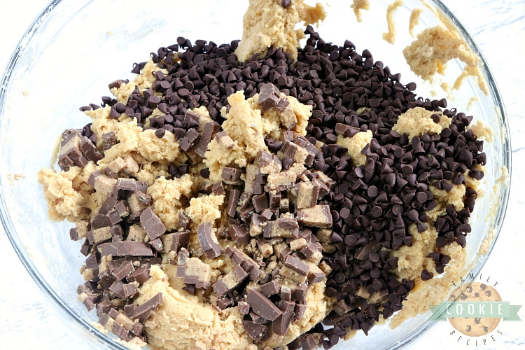 Adding Reese's peanut butter cups and chocolate chips to peanut butter cookies