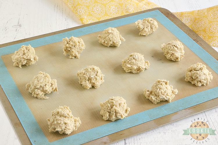 Placing oatmeal cookie dough balls on cookie sheet 