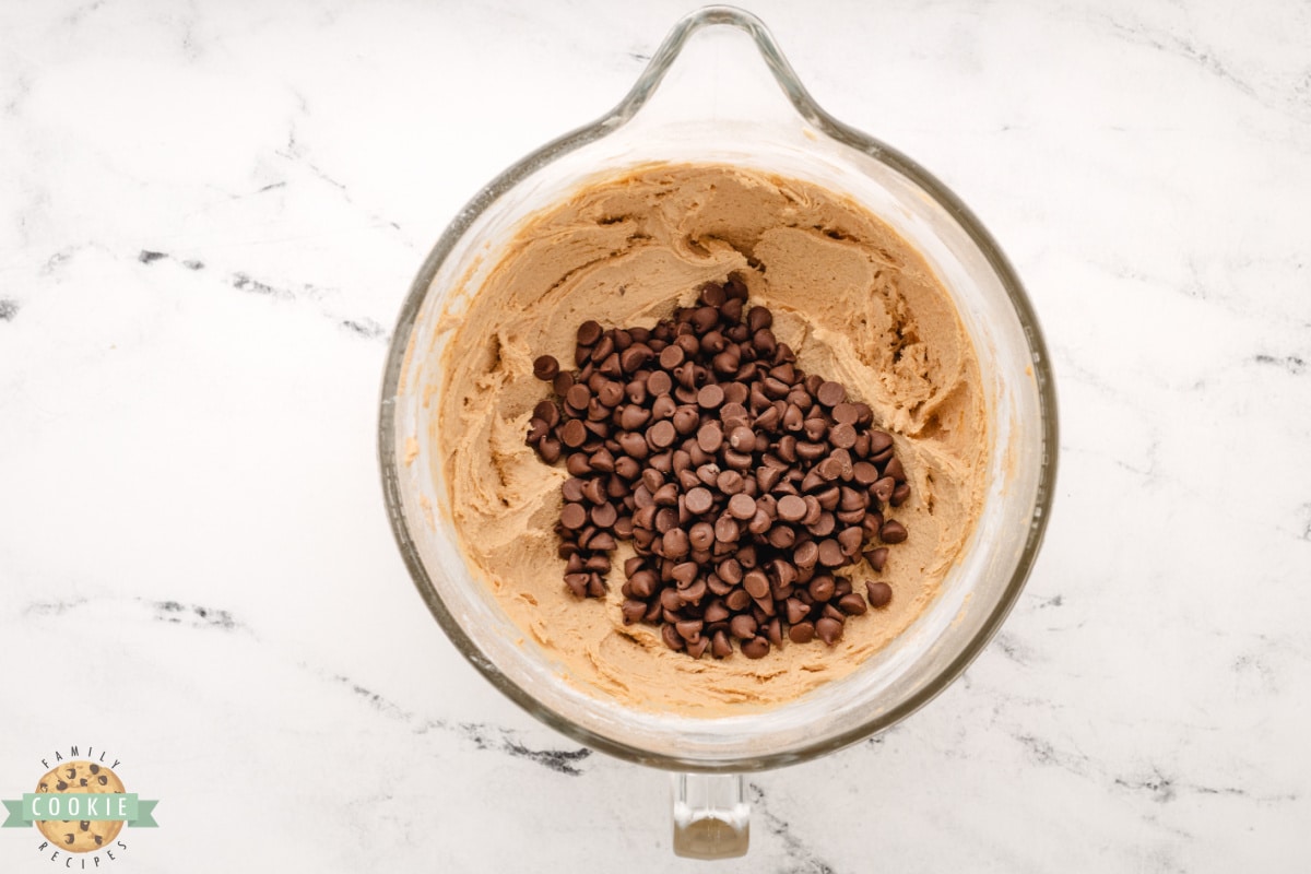 Add milk chocolate chips to butterscotch cookie dough. 