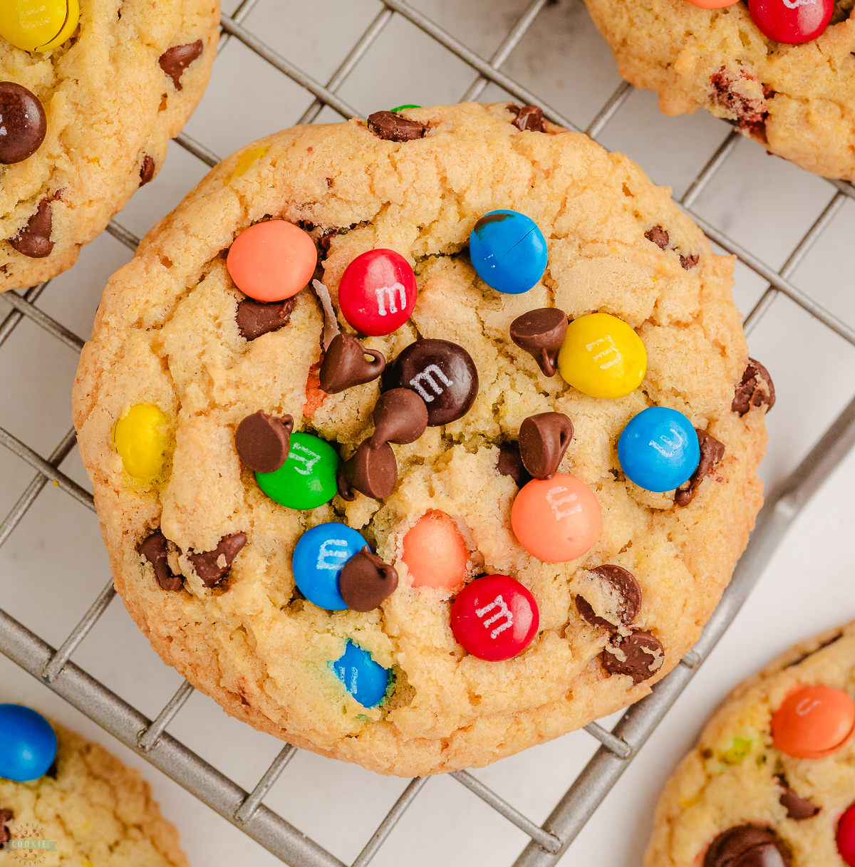 loaded chewy M&M cookies on a cooling rack