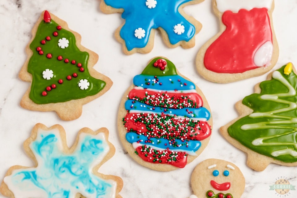 Classic Christmas Cut-Out Cookies perfect for the holidays! Easy sugar cookies for cookie cutters with a simple shiny cookie icing that everyone loves. 