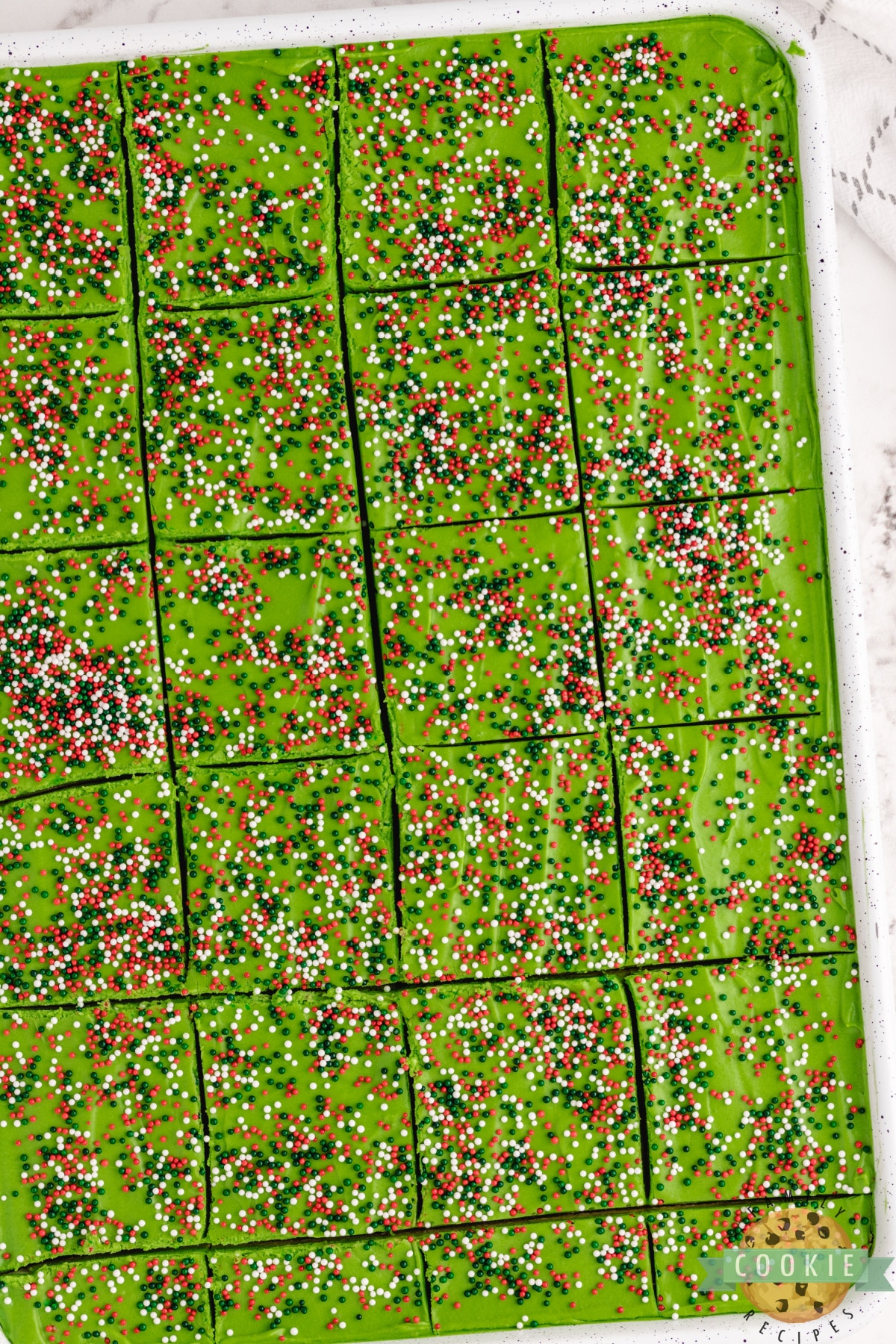 Pan of Christmas sugar cookie bars sliced into squares
