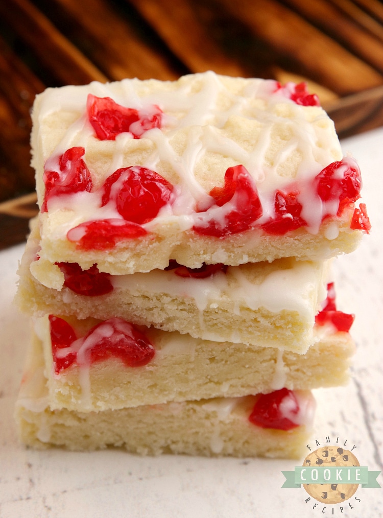 Cherry Almond Cookie Bars are simple cookie bars that fall somewhere between a shortbread and a sugar cookie. This cookie bar recipe is packed with almond flavoring and topped with chopped maraschino cherries and a simple powdered sugar glaze. 