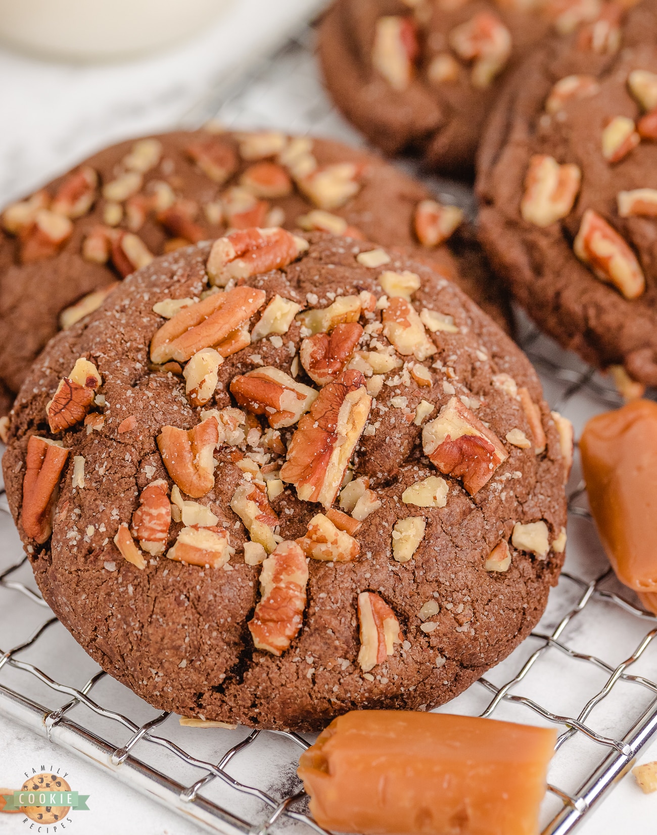 chocolate cookies stuffed with caramel and rolled in pecans