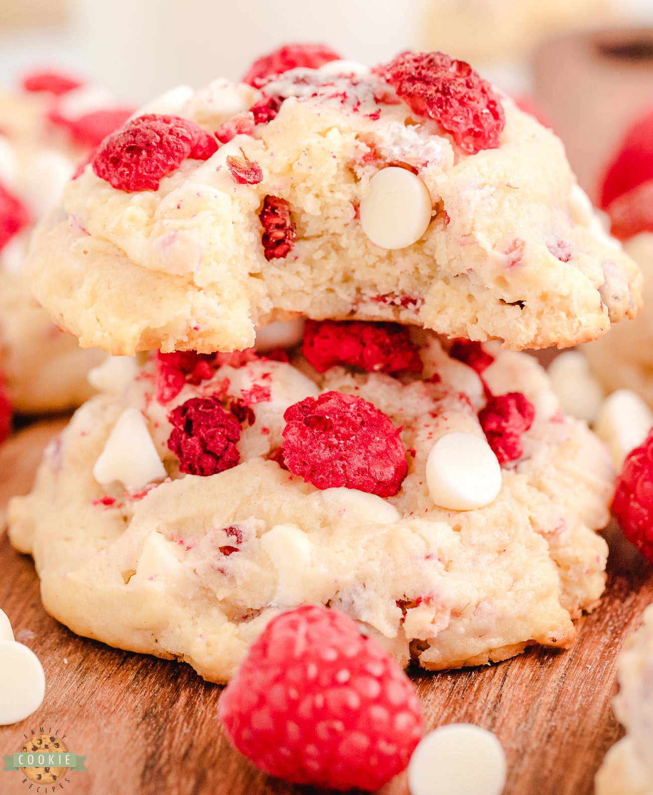 raspberry cheesecake cookies with a bite taken out