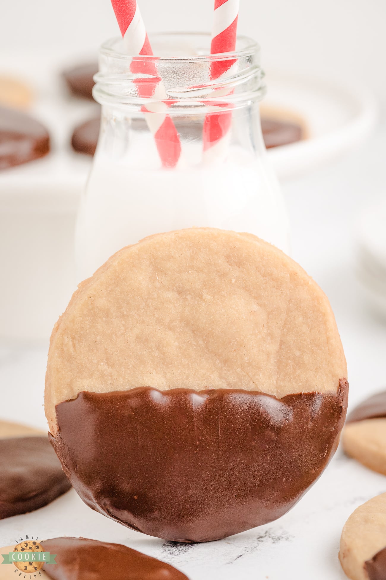 chocolate dipped brown sugar shortbread with a glass of milk