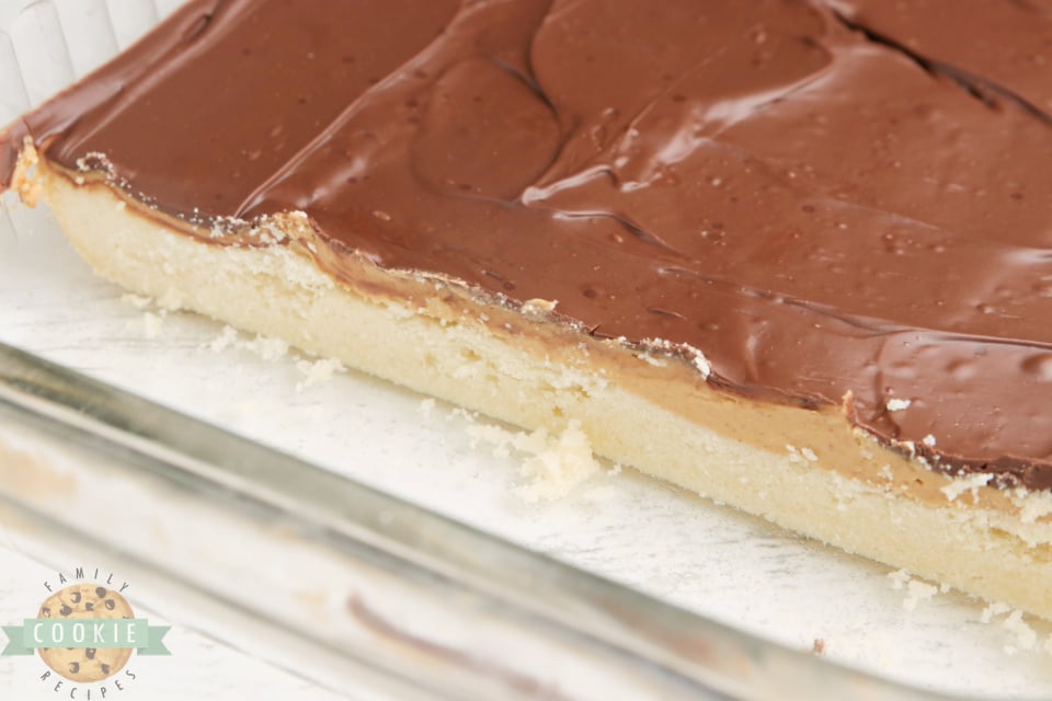Tagalong Cookie Bars made with a shortbread cookie crust with a peanut butter layer with chocolate on top. Simple to put together, and taste just like your favorite chocolate peanut butter Girl Scout cookies.
