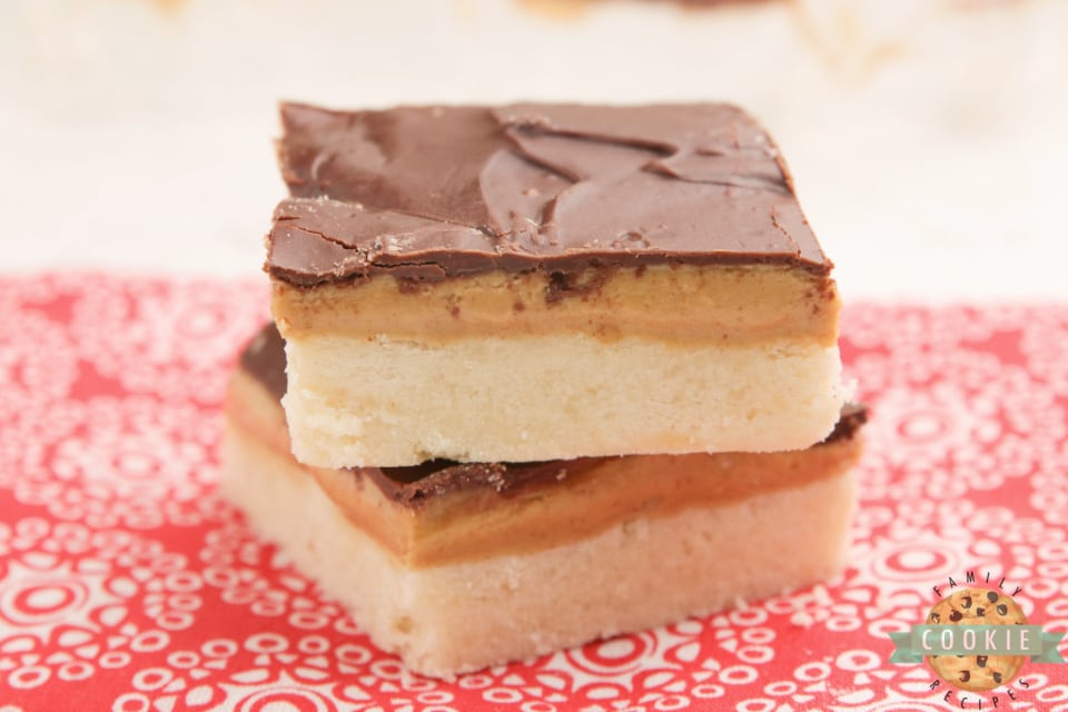 Tagalong Cookie Bars made with a shortbread cookie crust with a peanut butter layer with chocolate on top. Simple to put together, and taste just like your favorite chocolate peanut butter Girl Scout cookies.