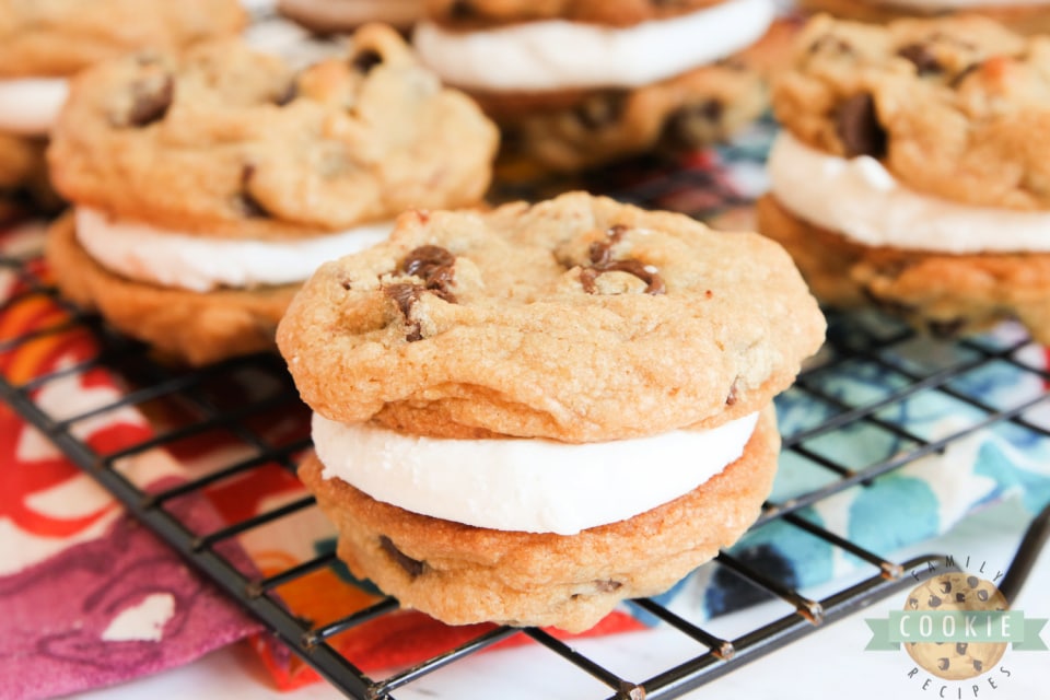 S'mores Cookie Sandwiches are made with graham cracker chocolate chip cookies and a simple marshmallow filling. Even if you don't love s'mores, you will love these cookie sandwiches! 