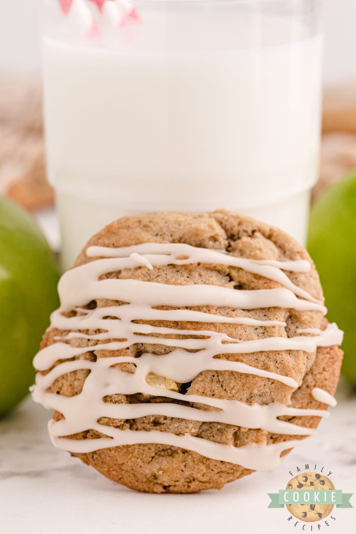 Vanilla Glazed Spiced Apple Cookies made with lots of spices, fresh apples and walnuts. Soft and chewy cookie recipe that is topped with a simple vanilla glaze.