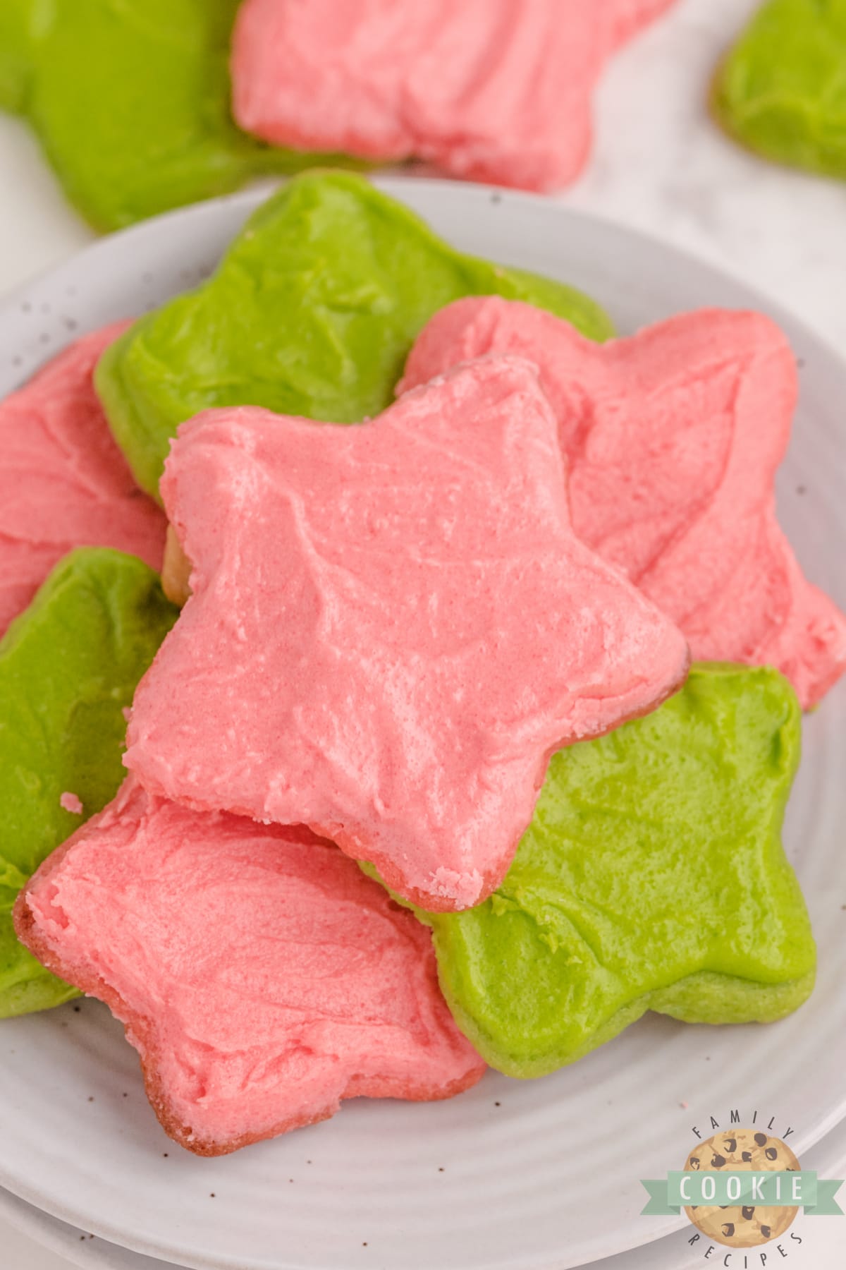 Christmas Jello Sugar Cookies made with red and green Jello in the cookies and the frosting. Festive and flavorful cut-out sugar cookies that can be made with any flavor of Jello! 