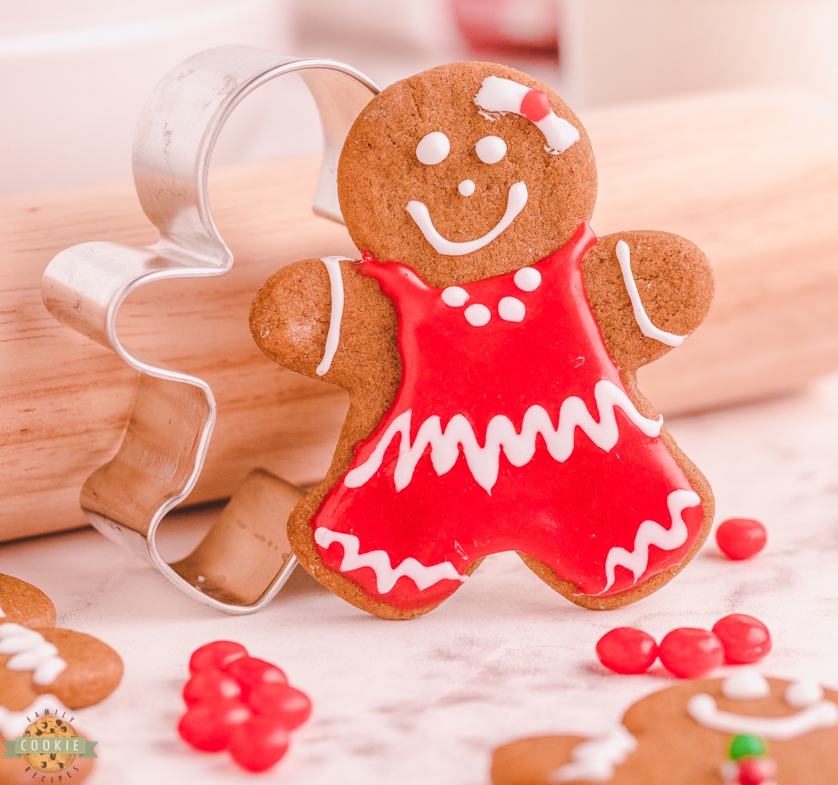 gingerbread girl next to a cookie cutter