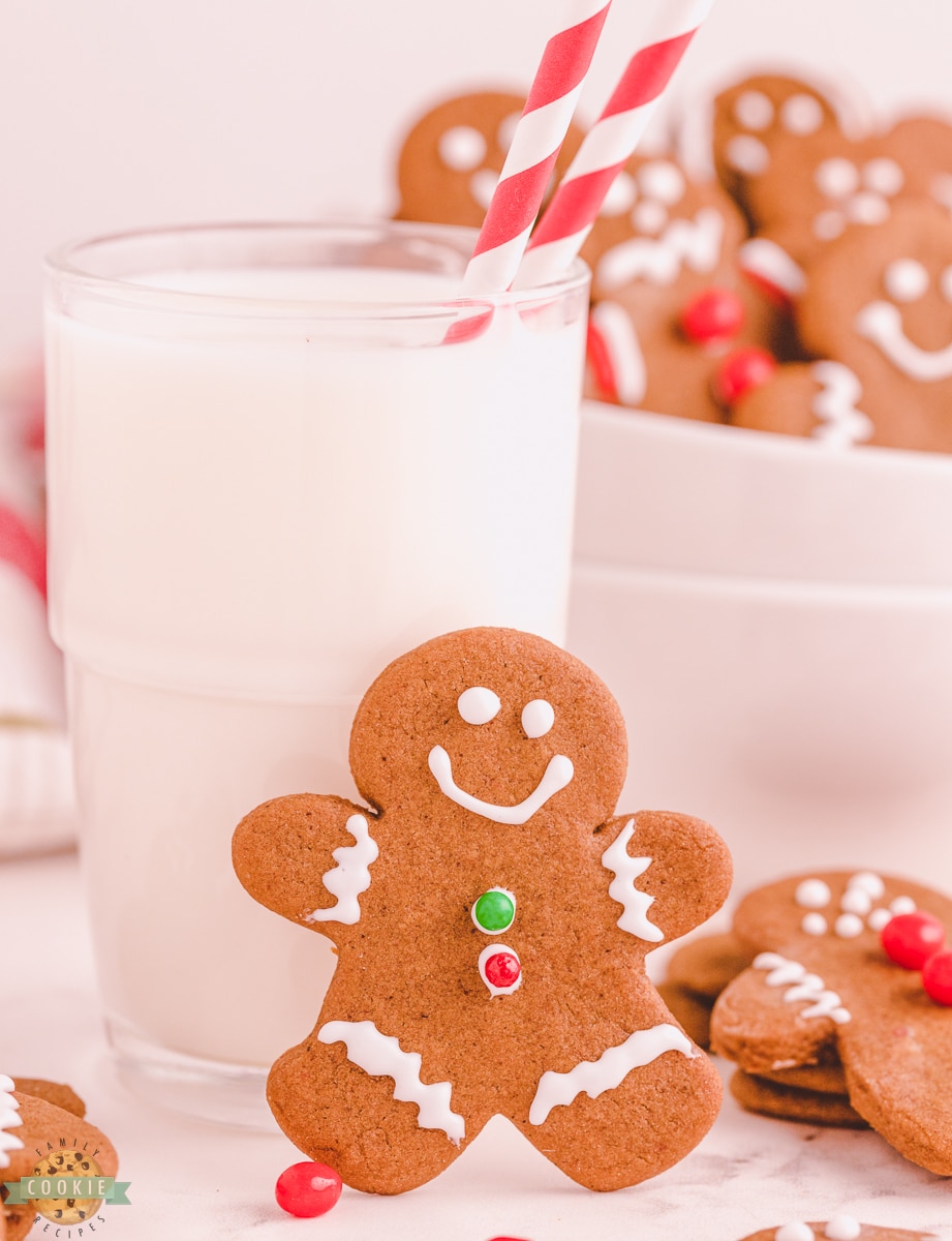 gingerbread boy cookie next to a glass of milk